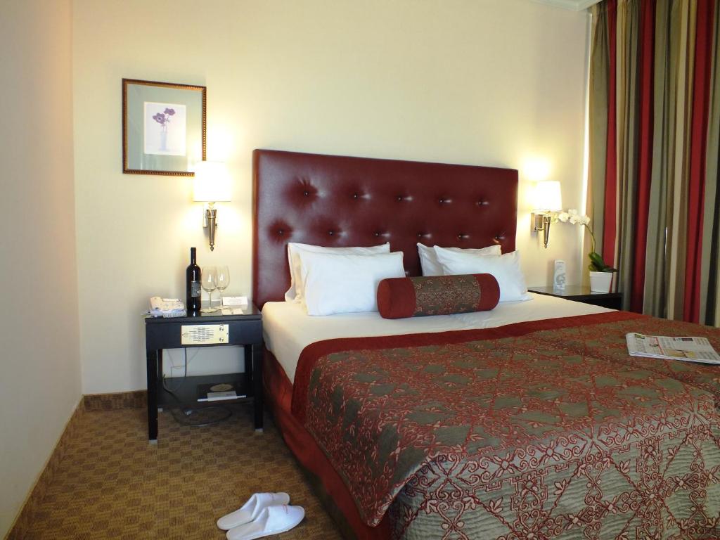 Postel nebo postele na pokoji v ubytování Prima Kings Hotel