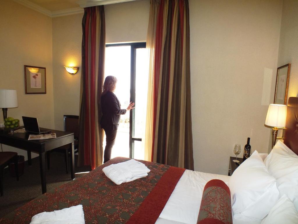 Postel nebo postele na pokoji v ubytování Prima Kings Hotel