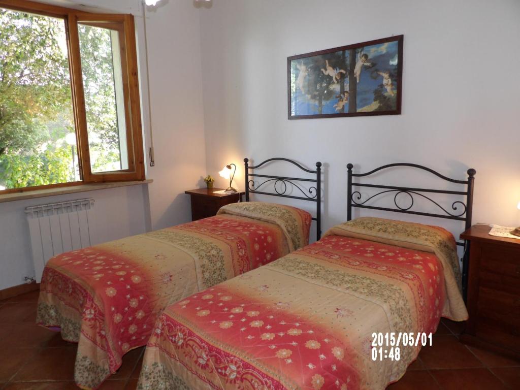 Posteľ alebo postele v izbe v ubytovaní Casa vacanza montecapino