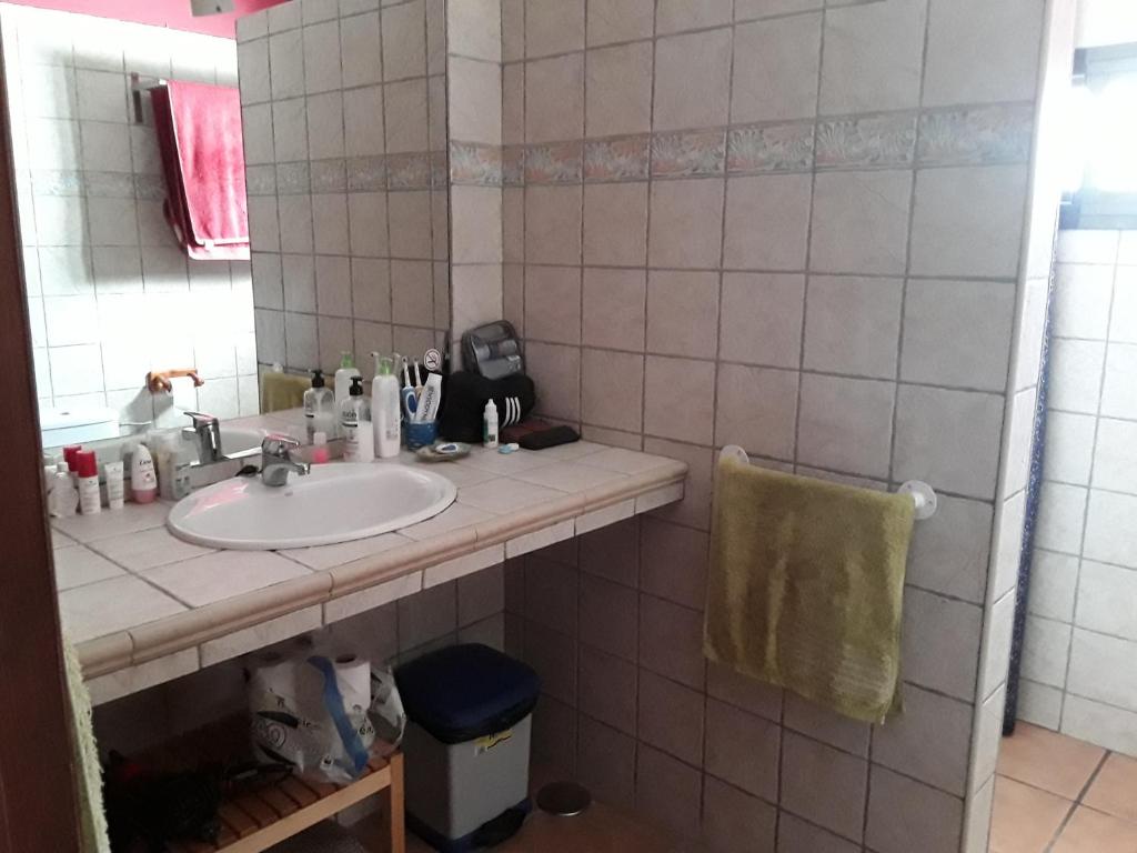 a bathroom with a sink and a mirror at Blue Beach in Famara