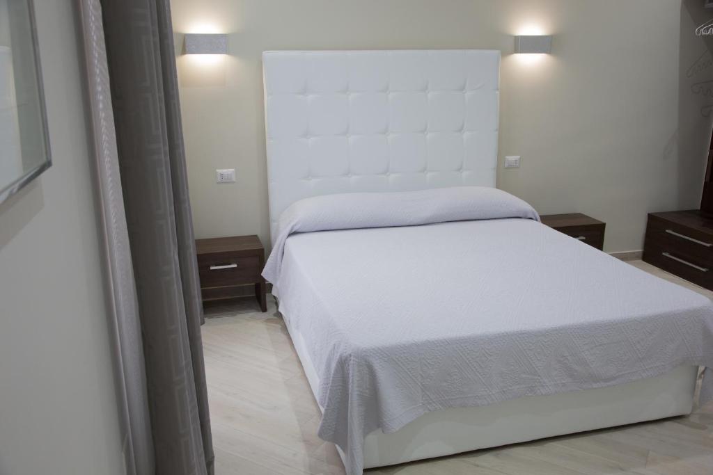 Postel nebo postele na pokoji v ubytování Venustas Roma Hotel