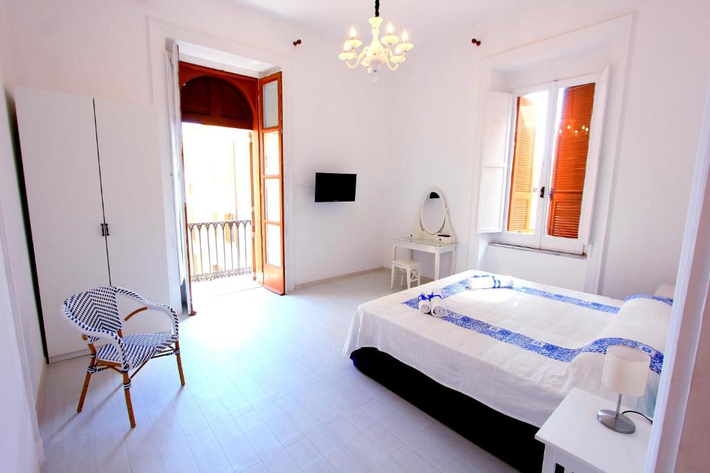 Postel nebo postele na pokoji v ubytování B&B Vitruvio Suites
