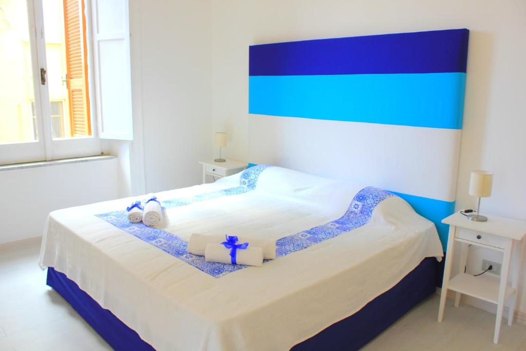 Postel nebo postele na pokoji v ubytování B&B Vitruvio Suites