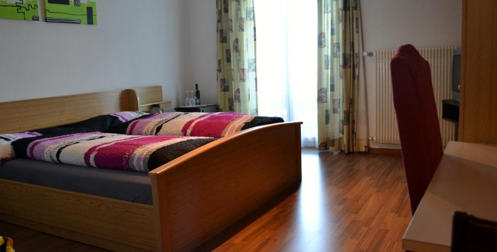 Postel nebo postele na pokoji v ubytování Landgasthof Hölzlisberg