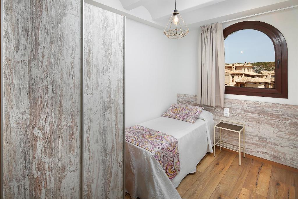 Postel nebo postele na pokoji v ubytování El Portal de Alquezar