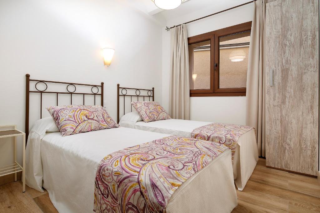 Postel nebo postele na pokoji v ubytování El Portal de Alquezar