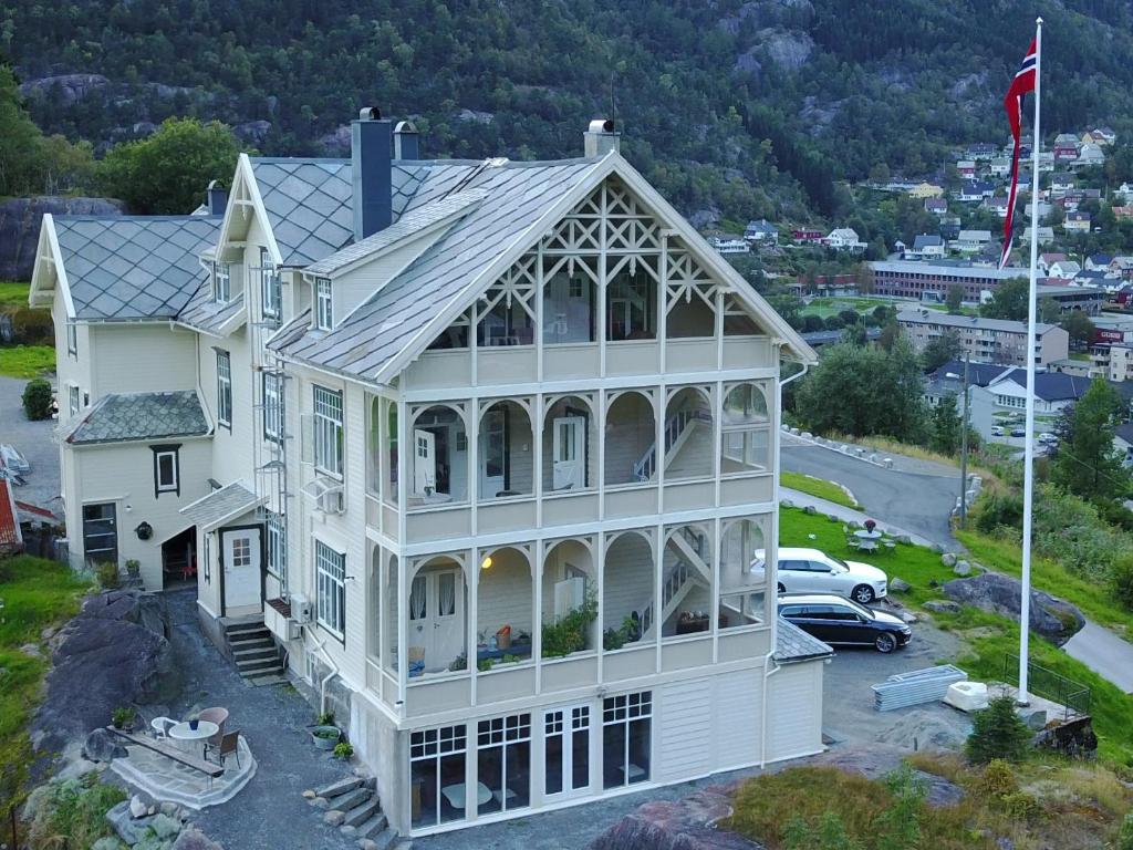 an aerial view of a large white house at Vikinghaug in Odda
