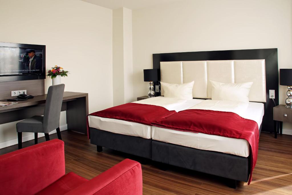 Postel nebo postele na pokoji v ubytování Milbor Hotel
