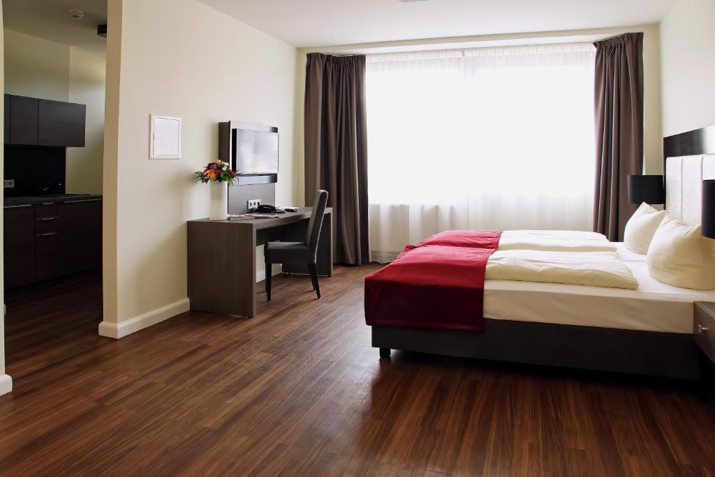 Postel nebo postele na pokoji v ubytování Milbor Hotel