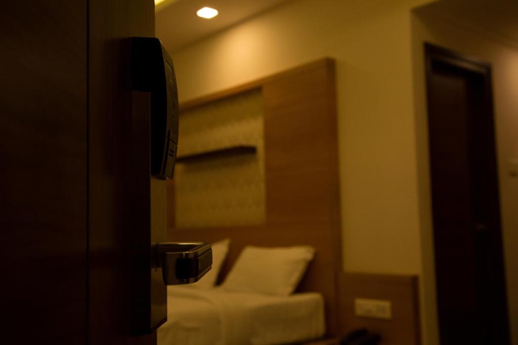 Postel nebo postele na pokoji v ubytování Hotel Grand Tree