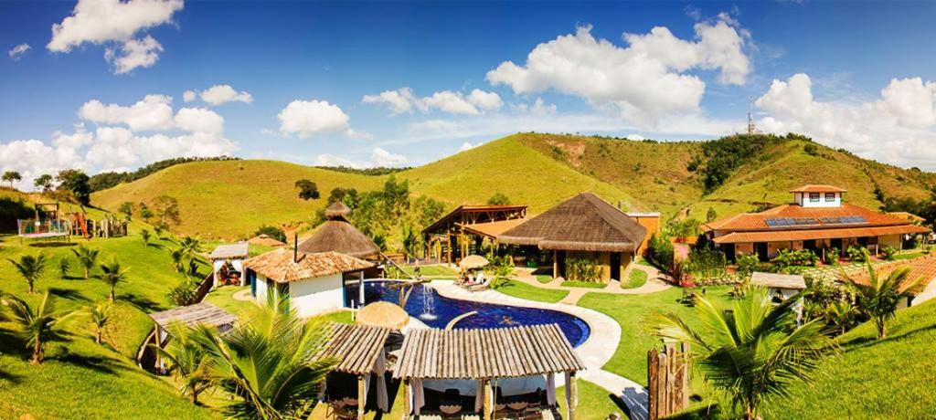 an aerial view of a resort with a swimming pool at Hotel Fazenda Cheiro Verde in Mercês