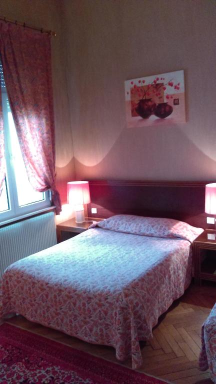 Postel nebo postele na pokoji v ubytování Hotel de l'Orangerie