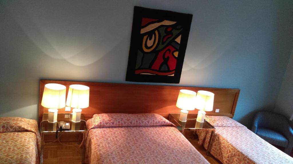 Postel nebo postele na pokoji v ubytování Hotel de l'Orangerie