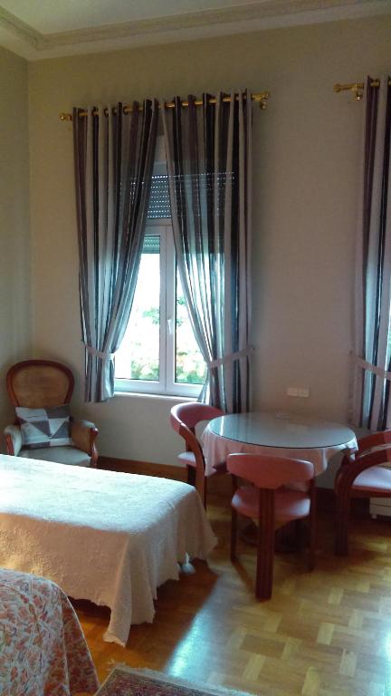 Postel nebo postele na pokoji v ubytování Hotel de l'Orangerie