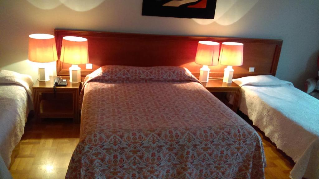 Postel nebo postele na pokoji v ubytování Hotel de l'Orangerie