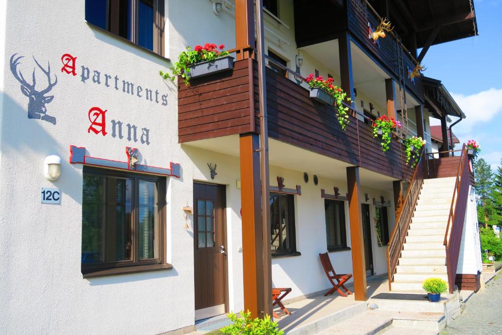 a building with flowers on the side of it at Apartments Anna in Tahkovuori