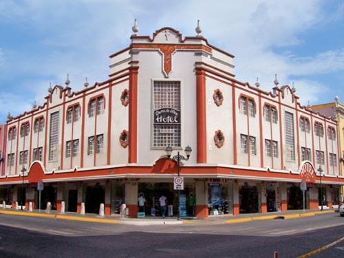 a large building on the corner of a street at Hotel Sierra de Alica in Tepic