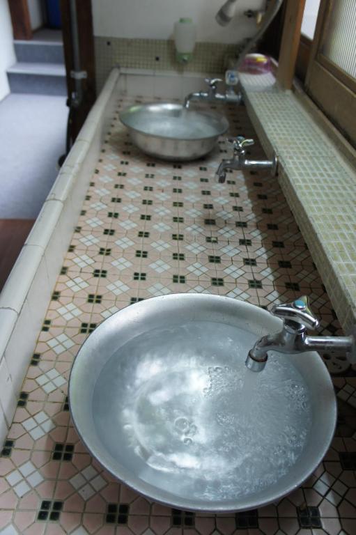 Koupelna v ubytování Miyoshiya Ryokan