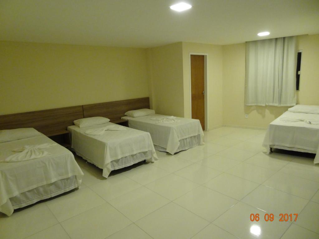 Postel nebo postele na pokoji v ubytování Ilha Bela Hotel
