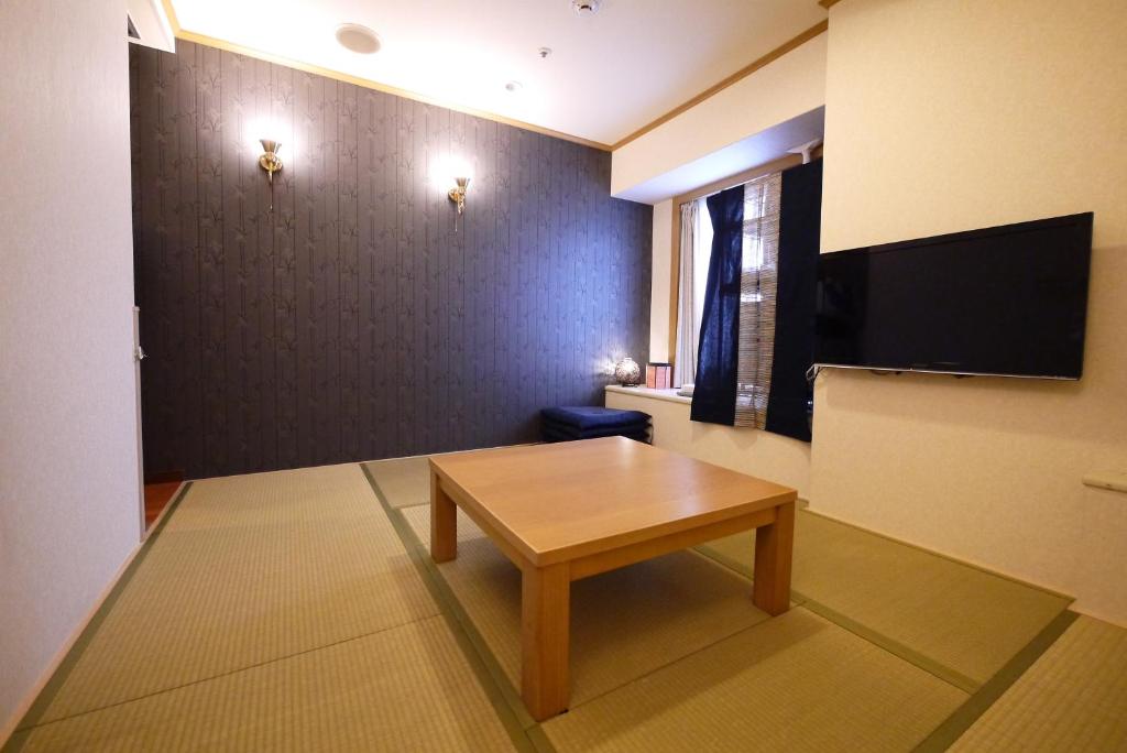 TV a/nebo společenská místnost v ubytování U-Community Hotel