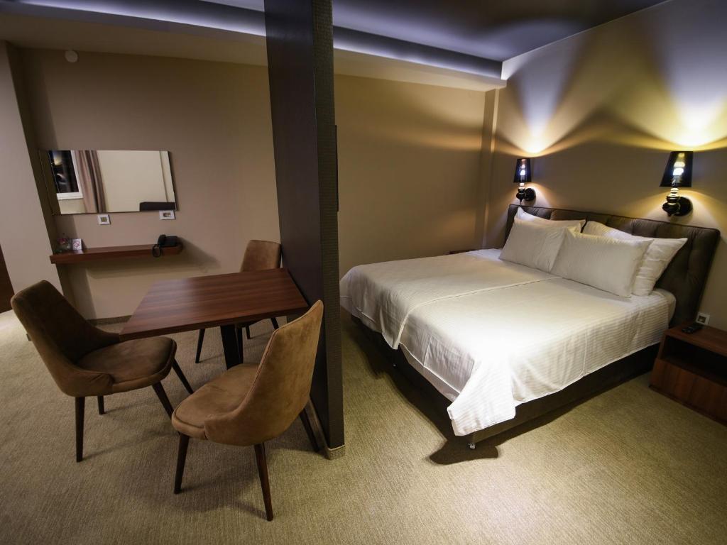 Voodi või voodid majutusasutuse Hotel Ideo Lux toas