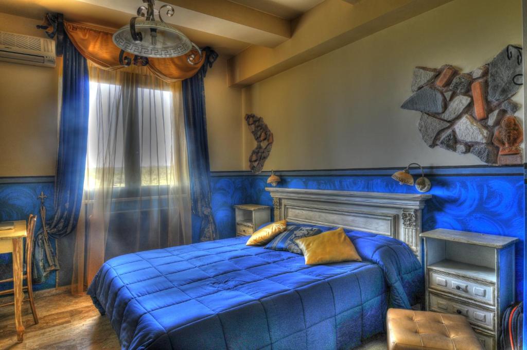 Postel nebo postele na pokoji v ubytování Guest House Qui Dormì L'Etrusco