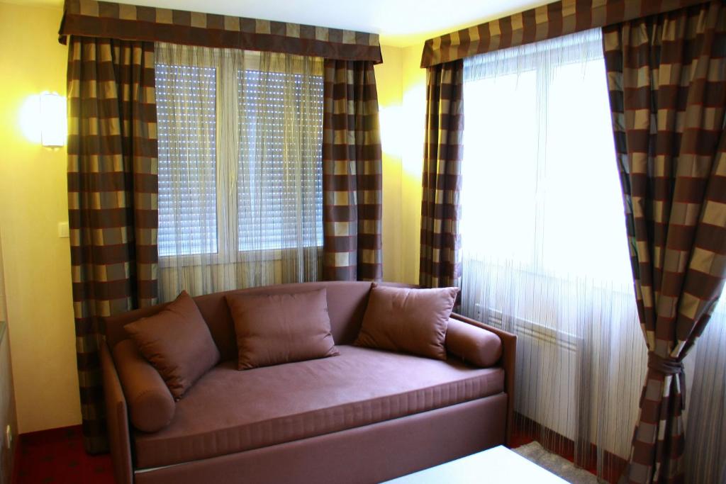 Posezení v ubytování Hôtel Le Commerce