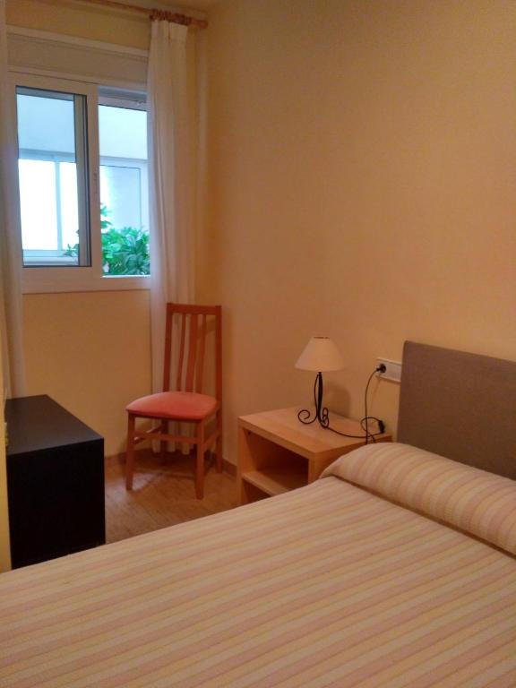 Posteľ alebo postele v izbe v ubytovaní Apartamento Columbretes