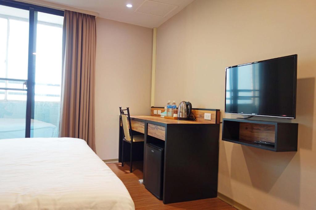 Voodi või voodid majutusasutuse 鼎立安商務旅館 Dinglian Hotel toas