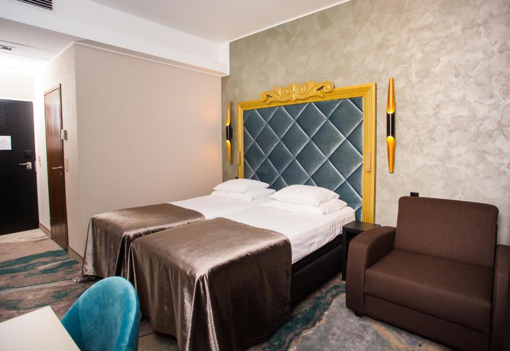 Postel nebo postele na pokoji v ubytování Aqva Hotel & Spa