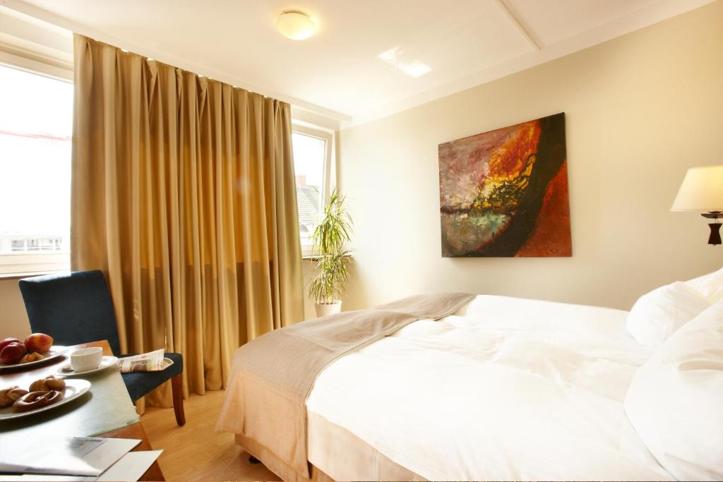 Postel nebo postele na pokoji v ubytování Hotel am Kieler Schloss by Première Classe