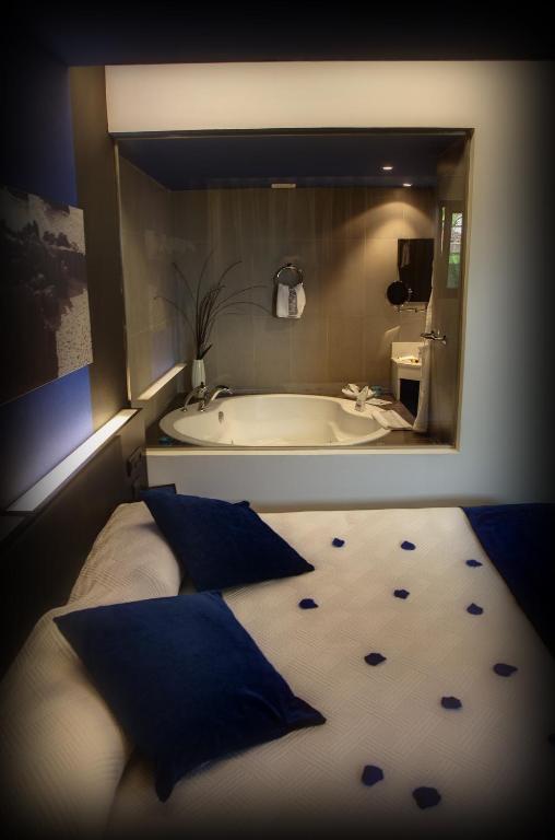 Postel nebo postele na pokoji v ubytování Hotel Playa Ribera
