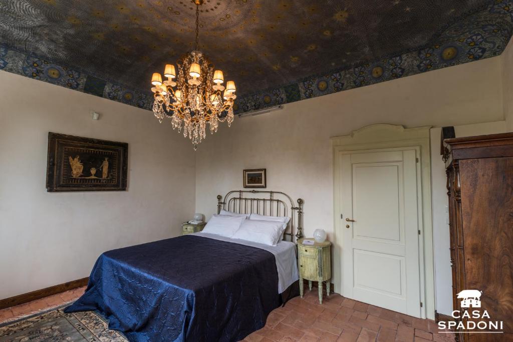 Llit o llits en una habitació de Locanda di Casa Spadoni