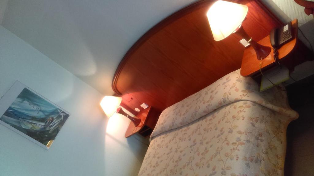 Postel nebo postele na pokoji v ubytování Hotel de l'Orangerie