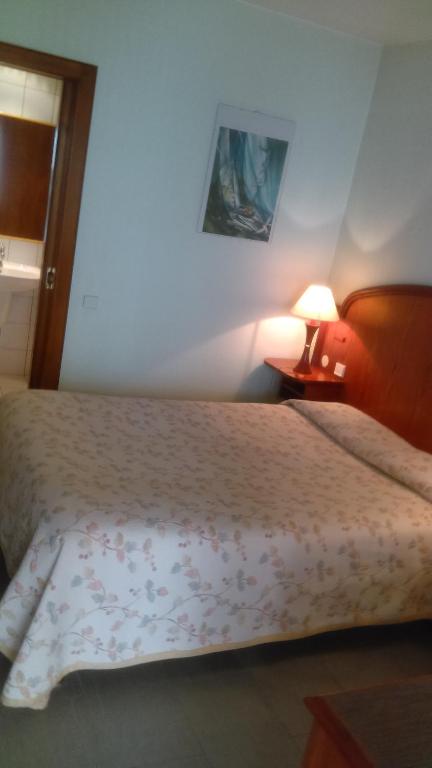 Postel nebo postele na pokoji v ubytování Hotel de l'Orangerie