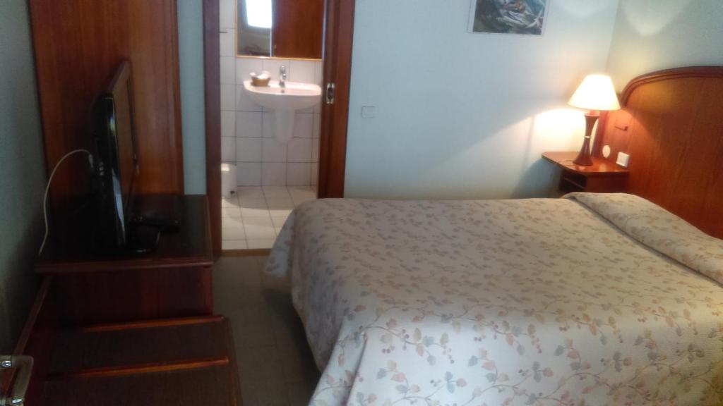 Postel nebo postele na pokoji v ubytování Hotel de l'Orangerie