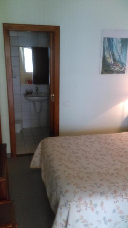 Postel nebo postele na pokoji v ubytování Hotel de l'Orangerie