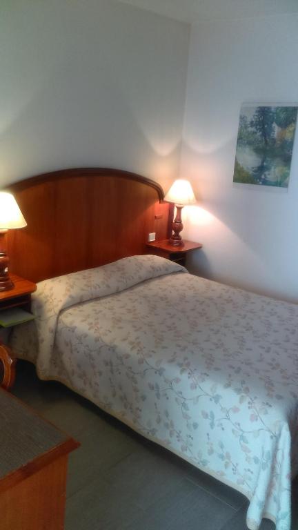 Postel nebo postele na pokoji v ubytování Hotel de l'Orangerie
