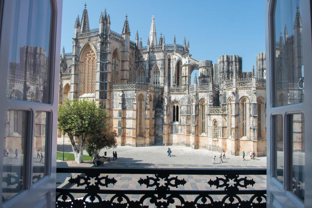 a view of a building from a window at Mosteiro View in Batalha