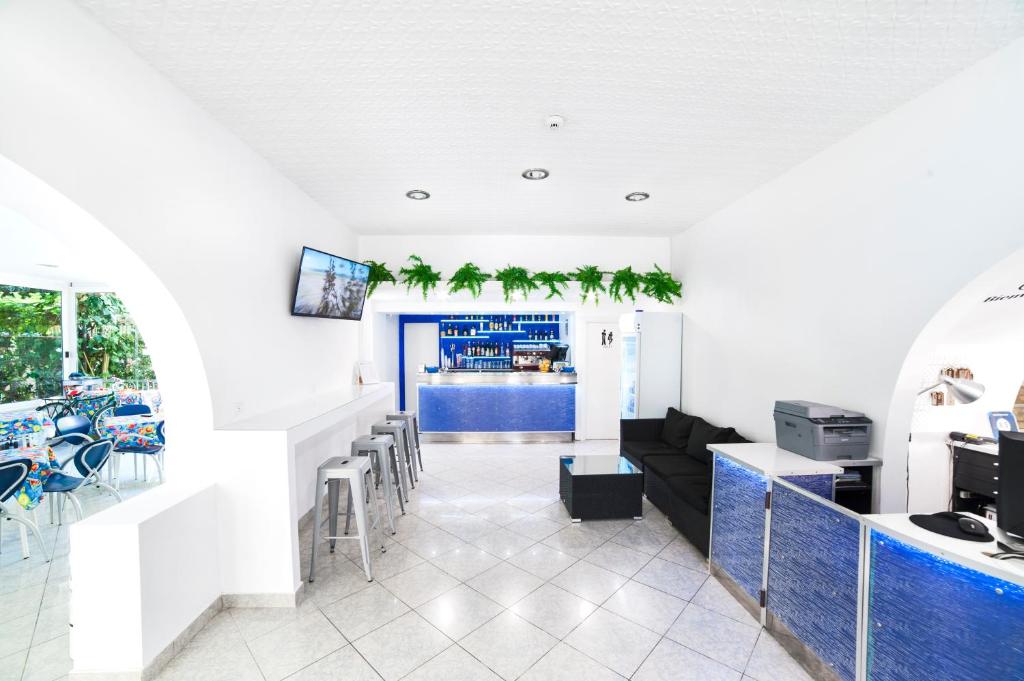 TV a/nebo společenská místnost v ubytování Mantovani Hotel Murano & Mariù