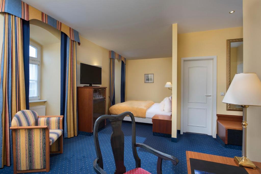 TV a/nebo společenská místnost v ubytování Radisson Blu Hotel Halle-Merseburg