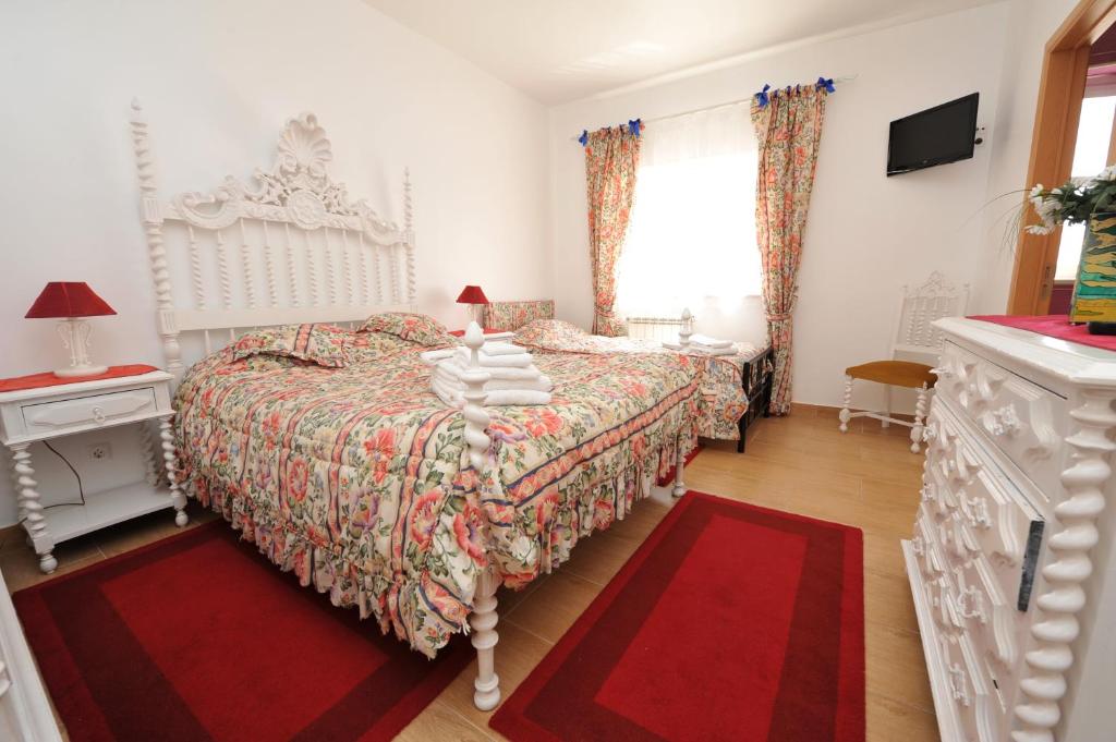Postel nebo postele na pokoji v ubytování Hotel Aviz
