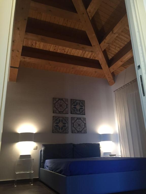 Postel nebo postele na pokoji v ubytování Borgo Ginuga