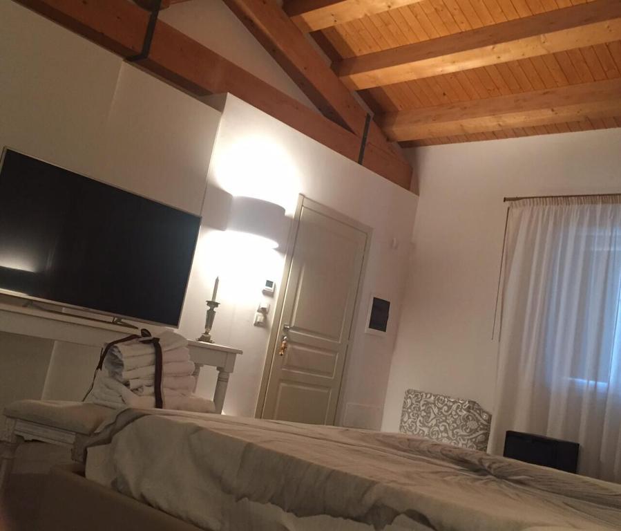 Postel nebo postele na pokoji v ubytování Borgo Ginuga