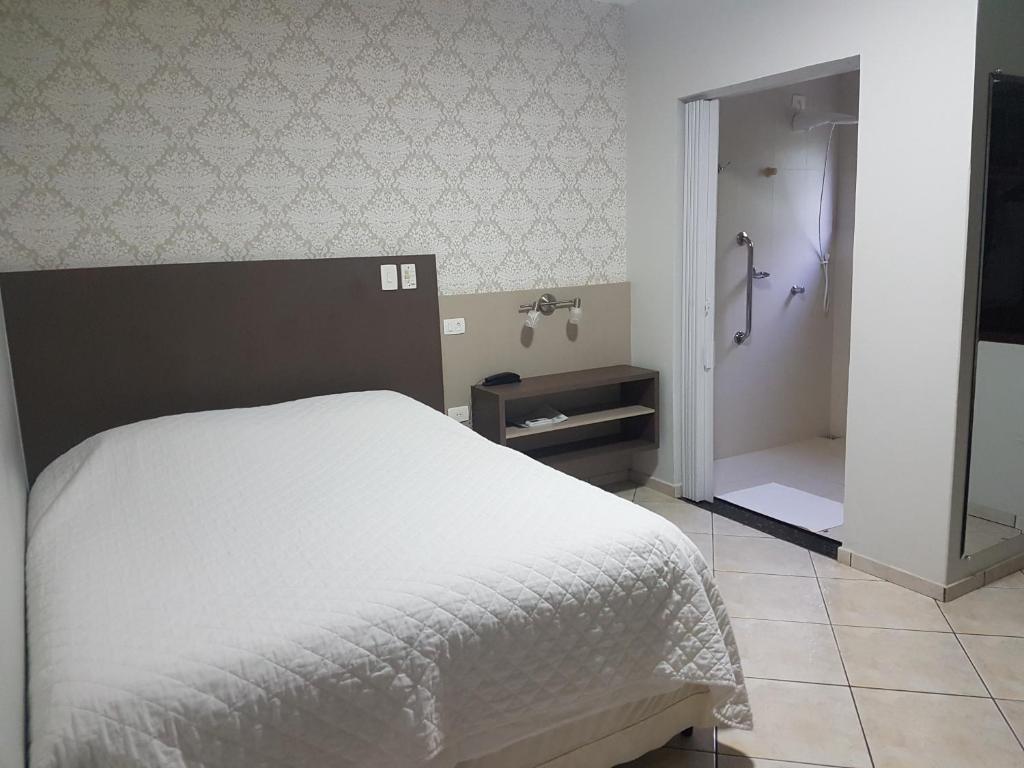 Postel nebo postele na pokoji v ubytování Hotel Nevada
