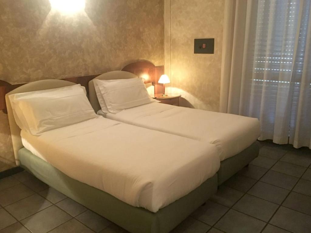 Letto o letti in una camera di Plus Welcome Milano