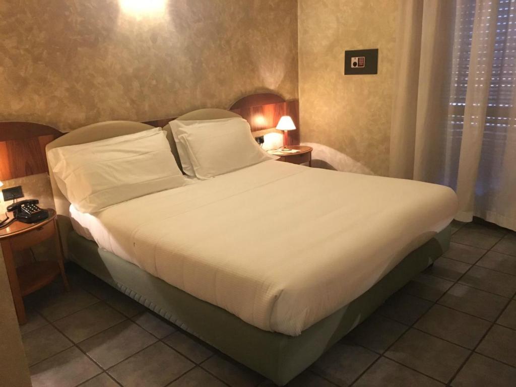 Letto o letti in una camera di Plus Welcome Milano