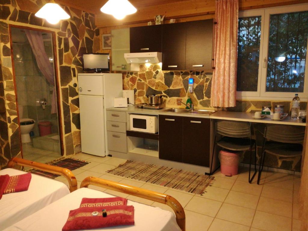 Kuchyň nebo kuchyňský kout v ubytování Apartments Zoumperi