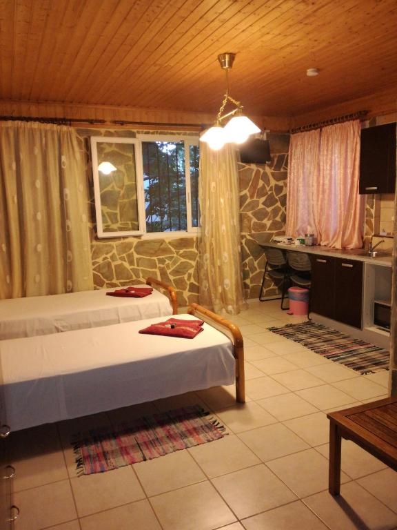 Postel nebo postele na pokoji v ubytování Apartments Zoumperi