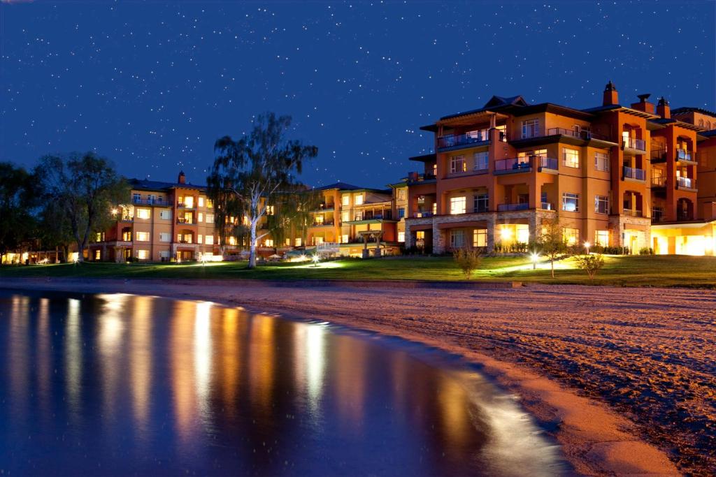 a building on the beach at night at Watermark Beach Resort in Osoyoos